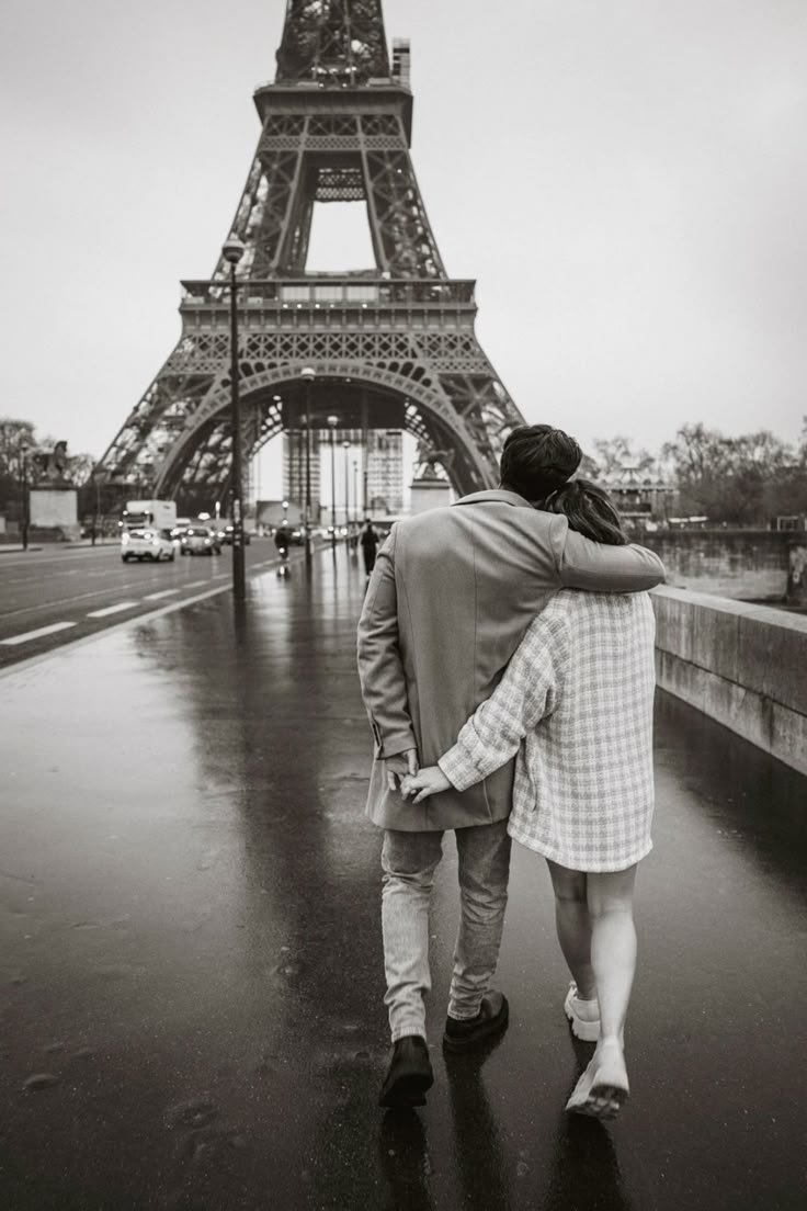 Couple walking towards Eiffel Tower